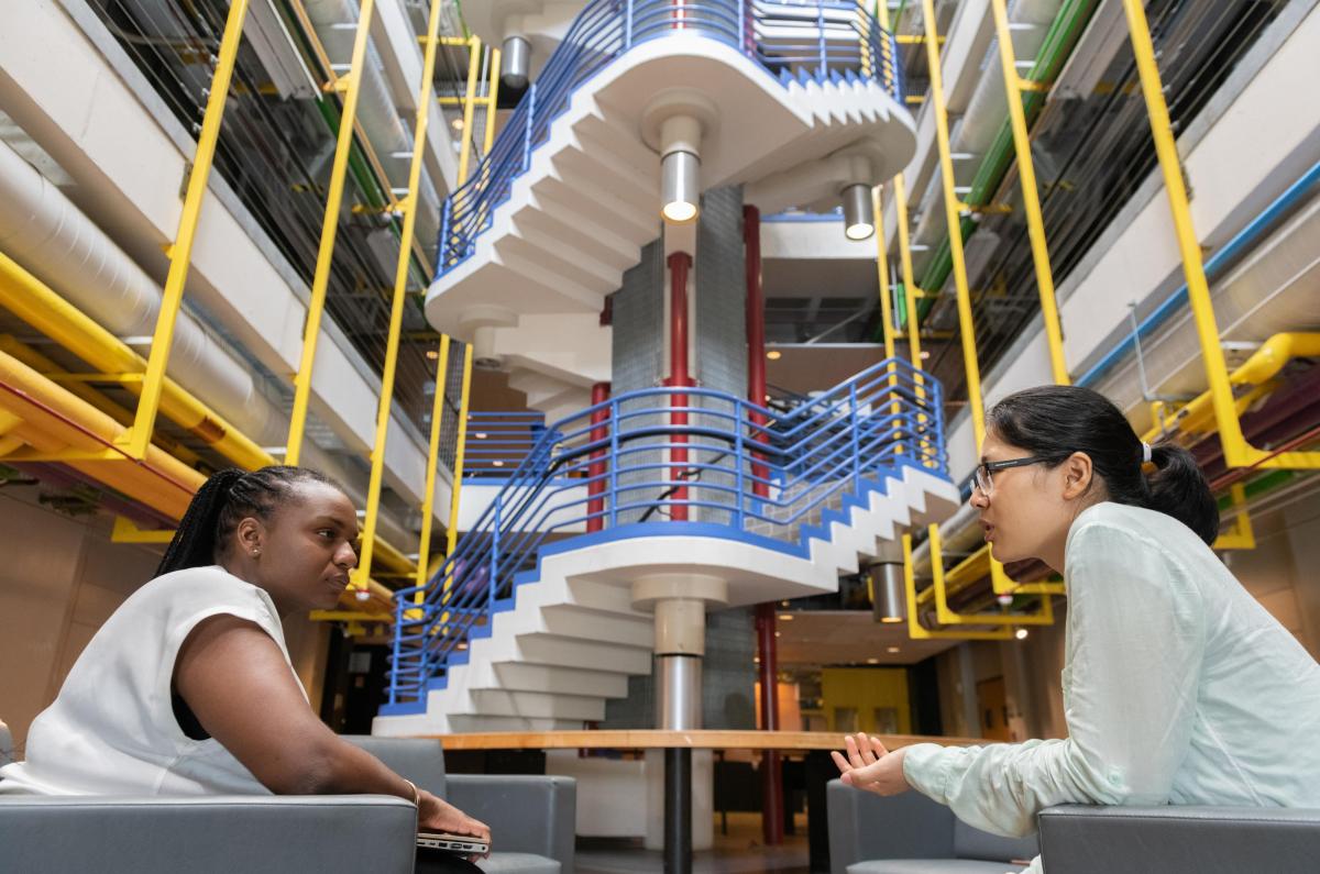 Two students talking to one another