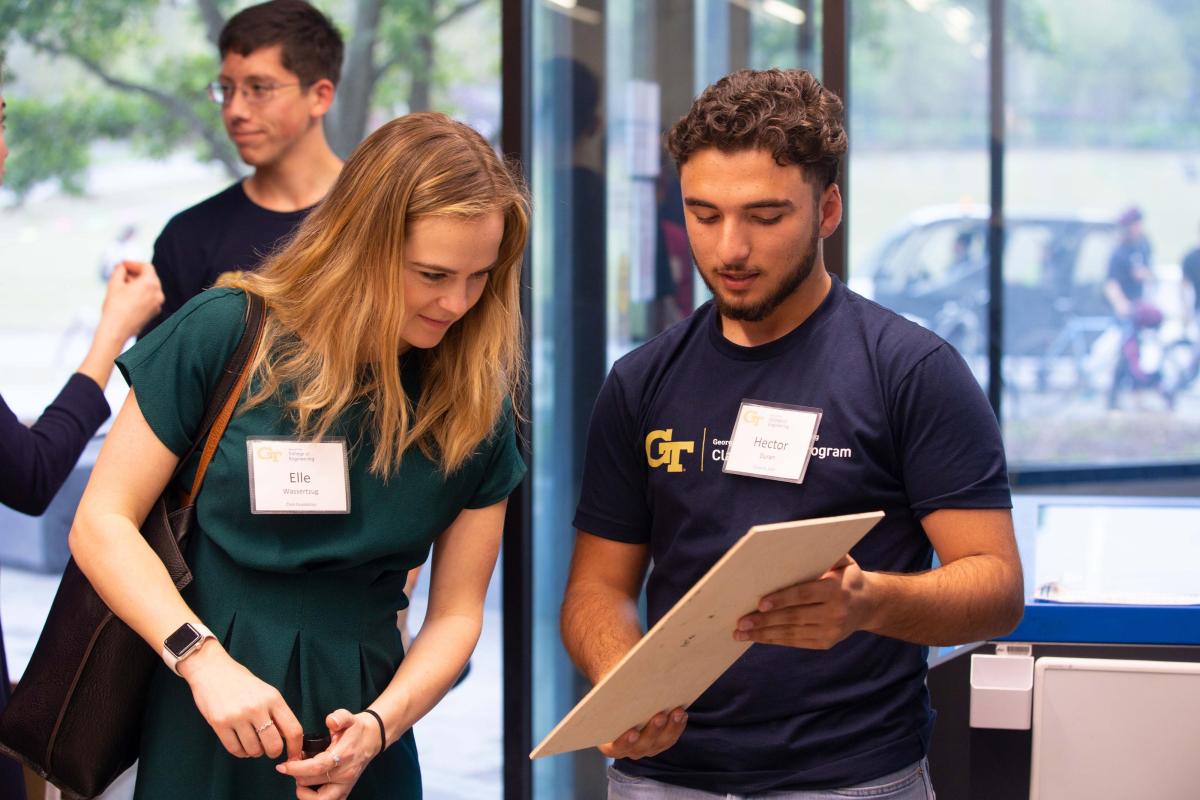 Students looking at print