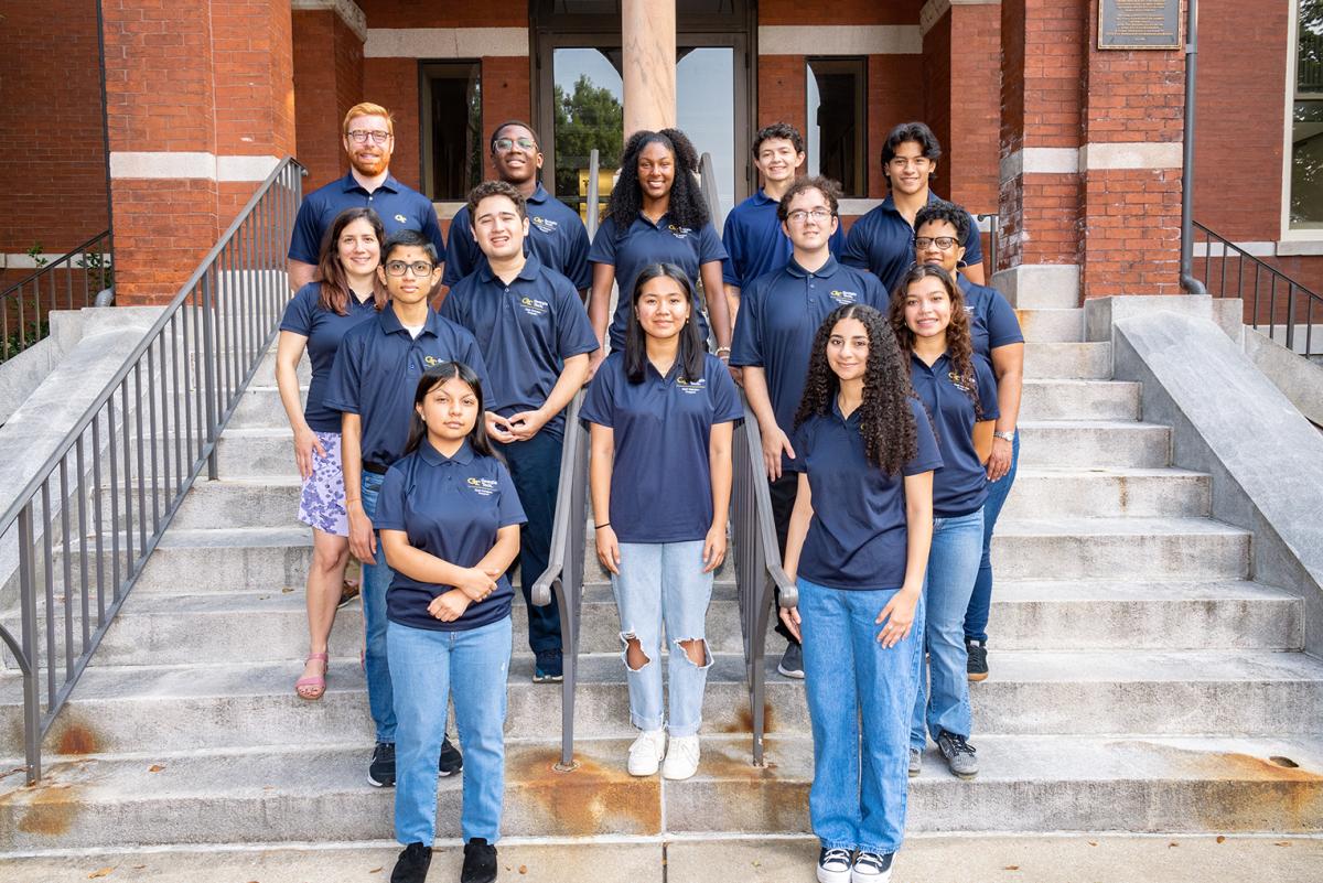 2023 Clark Scholars standing in a group on the steps of Tech Tower. (Photo: Candler Hobbs)