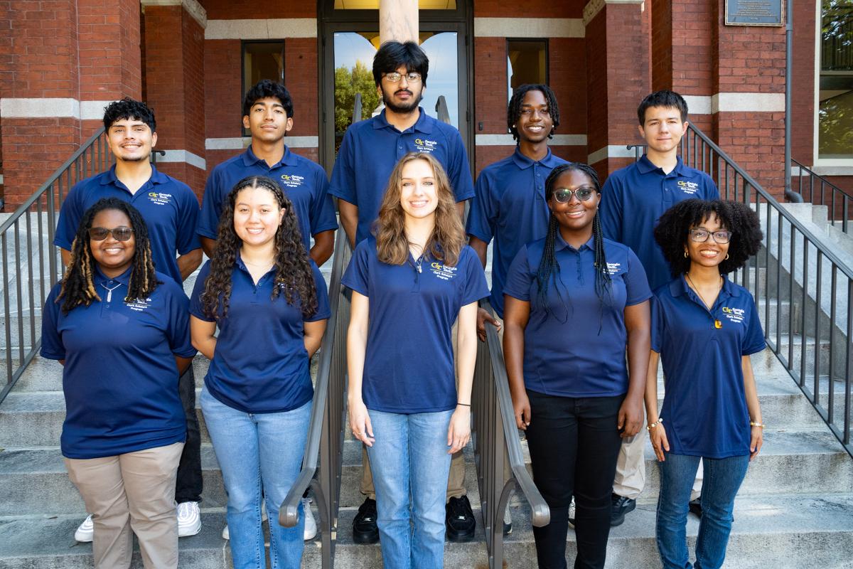 The 10 students in the 2024 Clark Scholars cohort standing on the front stairs of Tech Tower. (Photo: Candler Hobbs)